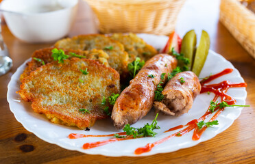 belarusian pancakes with sausages in a restaurant