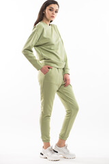 Fototapeta premium Fashion woman wearing warm hoodie on white background