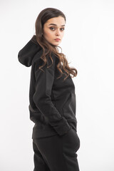 Woman in a warm fleece suit, studio shooting. Casual hoodie