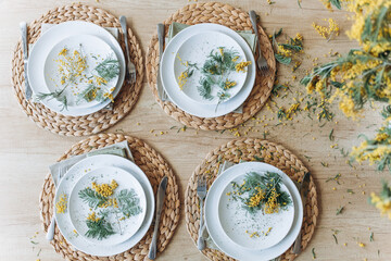 Stylish spring table setting in kitchen