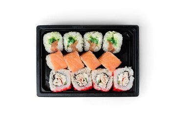 Sushi rolls in black box isolated on white background.