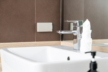 Close up shot of modern metallic faucet