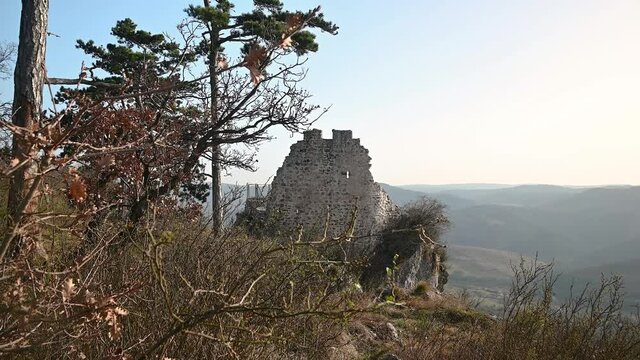 Crni kal fortress in Slovenia. Ruins of a castle overlooking Črni Kal village. Famous historic site. Handheld, wide angle