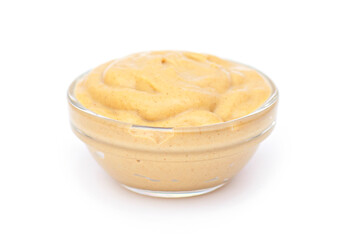 Mustard sauce in small glass bowl, isolated in white. Mustard sauce as dressing