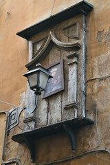 icon with stone frame on the facade of an old house - Rome, Italy