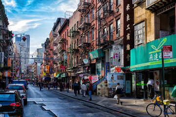 Street view of Chinatown district of New York City, one of oldest Chinatowns outside Asia. - obrazy, fototapety, plakaty