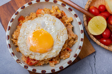 Fried rice, fried eggs and vegetables in ceramic cups