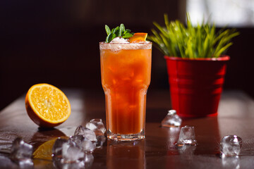 A cold cocktail standing on the table.