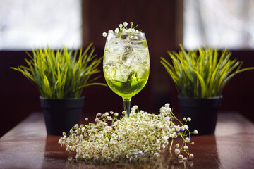 A cold cocktail standing on the table.