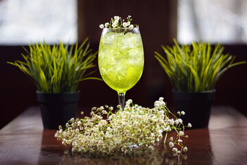A cold cocktail standing on the table.