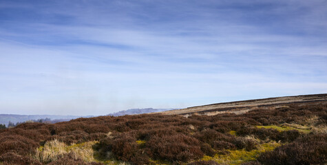 In March, smoke fills the air duriing heather burning on the grouse moorland in Yorkshire
