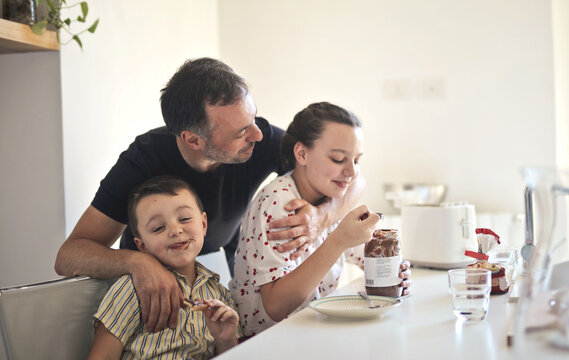 Family Has Breakfast In The Kitchen