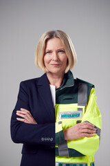 Concept Portrait Of Woman Showing Contrasting Day And Night Job Roles In Business And As Paramedic