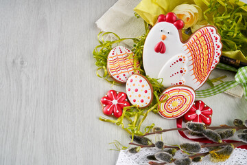 Easter composition of gingerbreads, eggs and willow branches