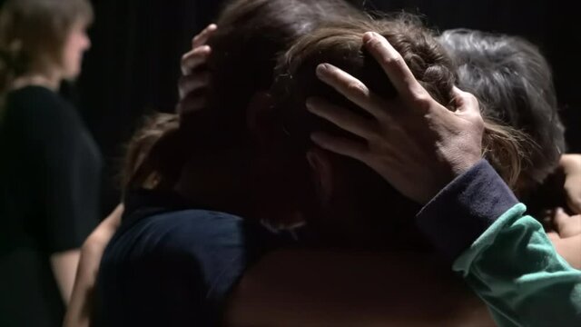 many dancers hugs and contact with hands hfr close-up