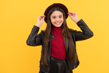 happy teen girl in hat and leather jacket, hipster