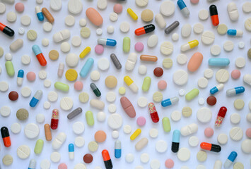 Heap of medicine pills and capsules from above.