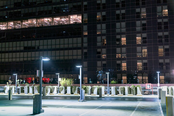 Parking lot against building at night.