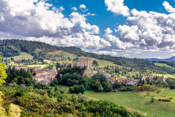 Fototapeta na wymiar Superb panoramic view of the historic center of Sant'Agata Feltria, Emilia Romagna, Italy, under a dramatic sky