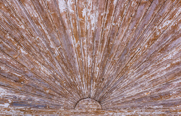 Old white painted wooden background. Texture in form of a sunbeam.