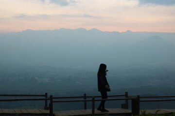 silhouette of a woman in a natural sky background