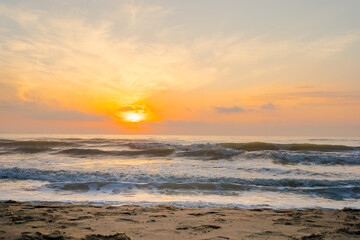Fototapeta na wymiar silhouette beach with sunrise and sea background