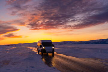 Fototapeta na wymiar car drives on the ice of the largest freshwater lake Baikal .