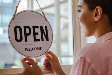 Smiling young asian business owner, employee retail,coffee shop woman,girl turning,setting sign...