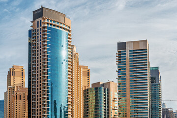 Residential buildings and hotels in high-rise buildings in the Dubai Marina area. The cost of real estate in the UAE
