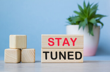 STAY TUNED. The text is on the light cubes. Bright solution for business, financial, marketing...