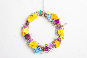 Braided wreath on white putty texture wall
