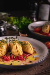 Traditional italian food culurgiones homemade pasta with potato on a plate