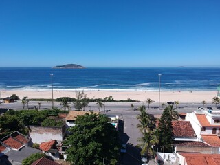 Fototapeta premium Aerial view of Piratininga beach in Niterói, Rio de Janeiro. Sunny day. Drone photo