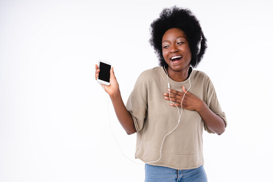 Cheerful Dancing Afro Teen Girl With Smart Phone Isolated Over White Background