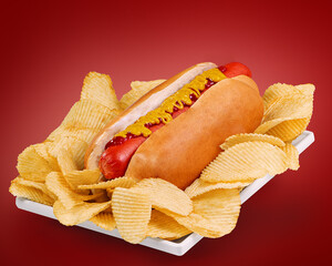 juicy hot dog with katchup and mustard over potato chips cradle
