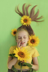 child with sunflower