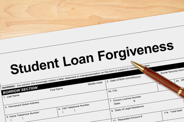 Student Loan Forgiveness application with pen