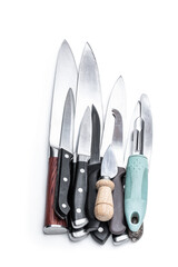 Set of different used and new kitchen knives isolated on white