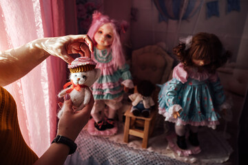 the master creates a handmade doll. hold a blank toy in your hands. plastic and rag collectible doll