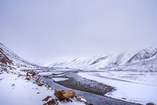 Snow covered beautiful landscape of Chandra river valley in Spiti during winter.  Spiti means 'The Middle Land' is a cold desert mountain valley located high in Himalayas of Himachal Pradesh, India.