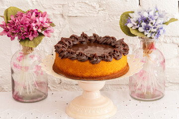 
Chocolate cake with chocolate cream icing and Easter rabbits complementing the scene