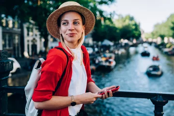 Papier Peint photo autocollant Amsterdam Trendy woman enjoying sightseeing in downtown