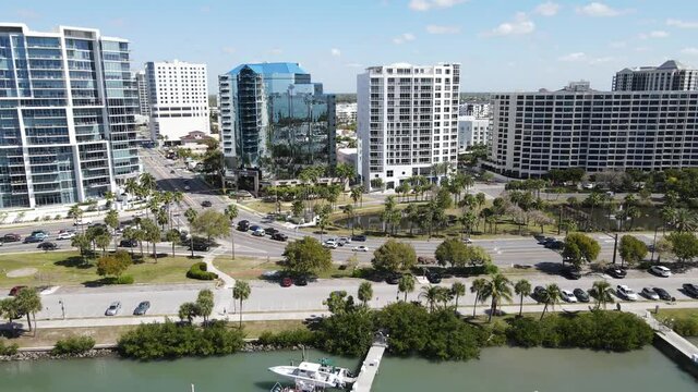 aerial focus on downtown Sarasota, Florida.  Bayfront drive and Gulf Stream roads. Mirrored highrises and Gulf-front businesses are shown