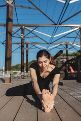 Woman doing fitness in seaside.