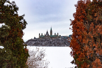 View of Canadian Parliament in winter from across the river