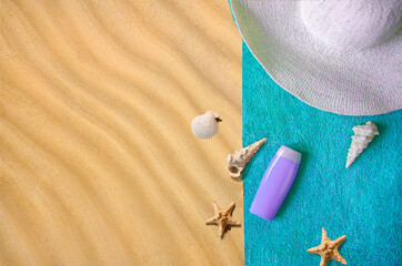 Fototapeta na wymiar Travel, vacation and summer vacation concept. Beach accessories white straw hats seashells, sunglasses and a palm branch on the sand