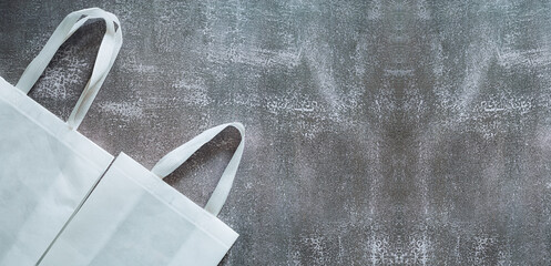 White tote bag mockup canvas fabric cloth eco shopping sack blank template isolated on blackboard background with copyspace