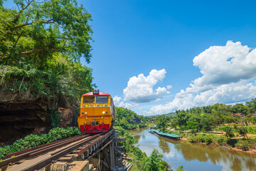 trains running on death railways track crossing kwai river in kanchanaburi thailand this railways important destination of world war II history builted by soldier prisoners