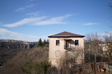 House in the middle of nowhere. blue skies in the village.