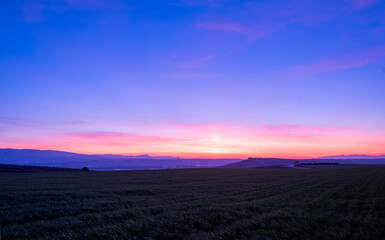 Sunset landscape ober the woods